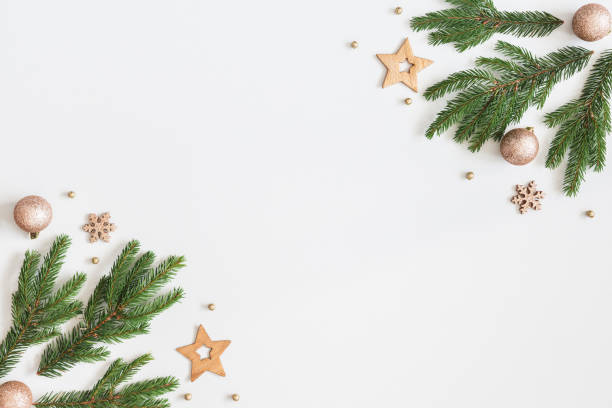 istock Christmas composition. Fir tree branches, golden decorations on pastel gray background. Christmas, winter, new year concept. Flat lay, top view, copy space 1058027584