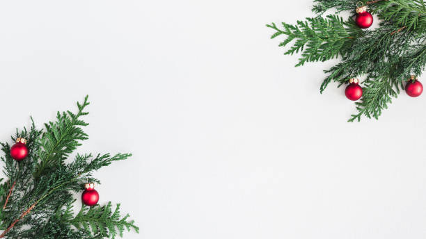 istock Christmas composition. Coniferous tree branches, balls on pastel gray background. Christmas, winter, new year concept. Flat lay, top view, copy space 1058028590