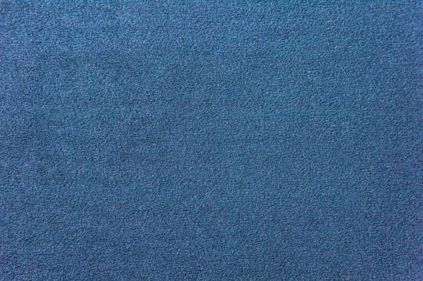 濃いブルーのカーペットの質感。グラデーション ライトのクローズ アップ - carpet sample ストックフォトと画像