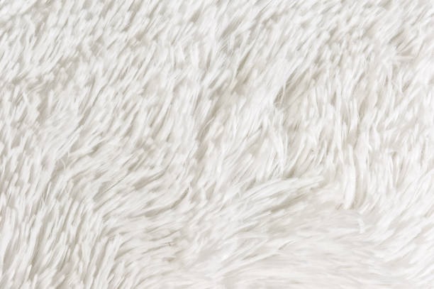 istock Fluffy plaid of polyester with a long heap gray. Comfortable home textiles. Background, texture 1058029450