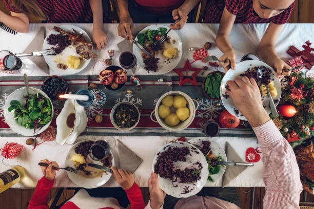 istock family dining at christmas table 1058032360