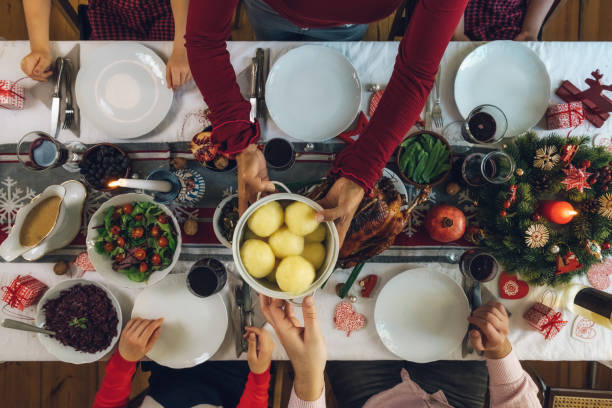 istock family dining at christmas table 1058032470