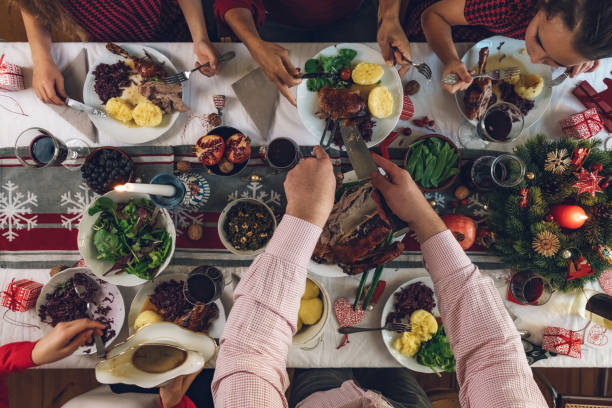 istock family dining at christmas table 1058032604