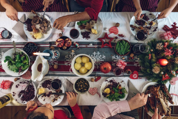 istock family dining at christmas table 1058033376