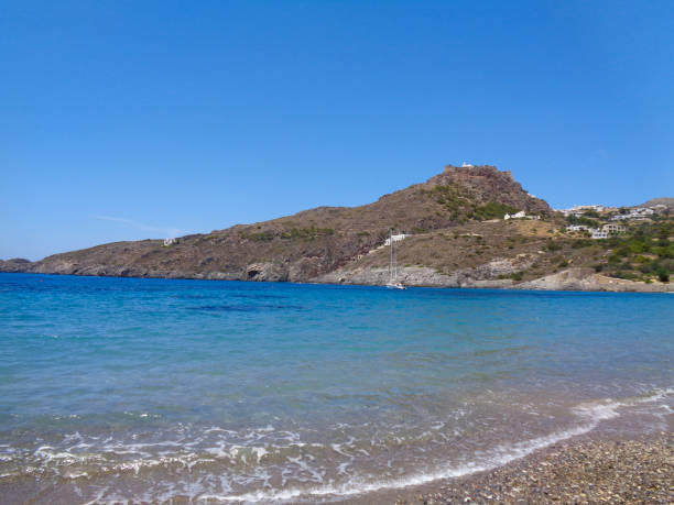 istock a bay in greece at summer with blue ocean 1058033498