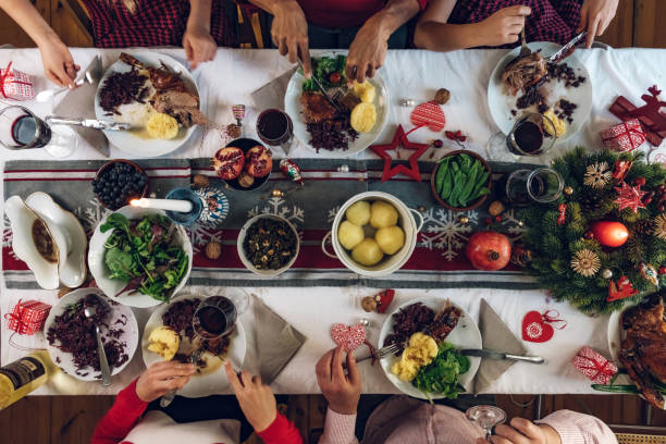 istock family dining at christmas table 1058033628