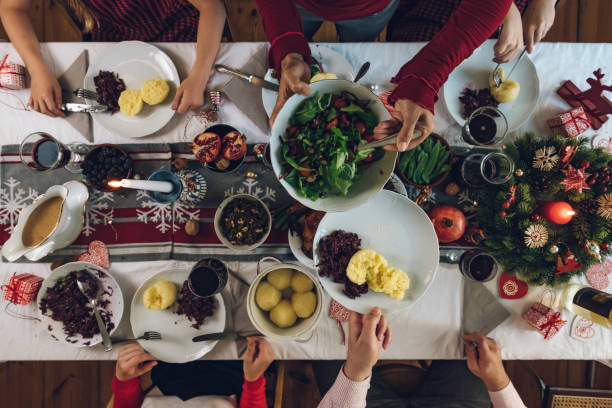 istock family dining at christmas table 1058035180