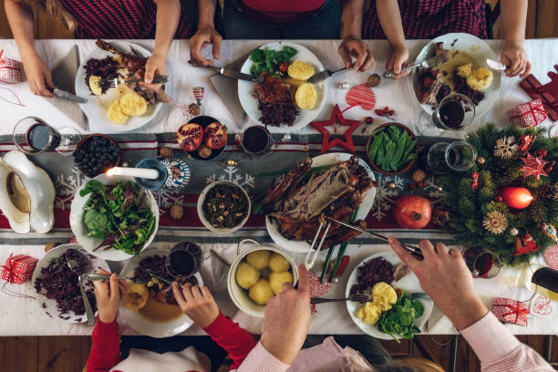 istock family dining at christmas table 1058035268