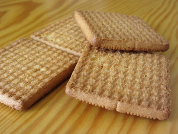 istock Close up of cookies on wooden table . Four biscuits for breakfast 1058035644