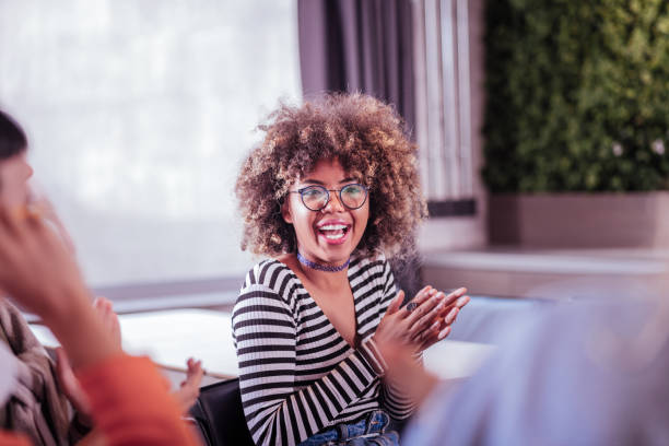 istock Happy international female person clapping her hands 1058035868