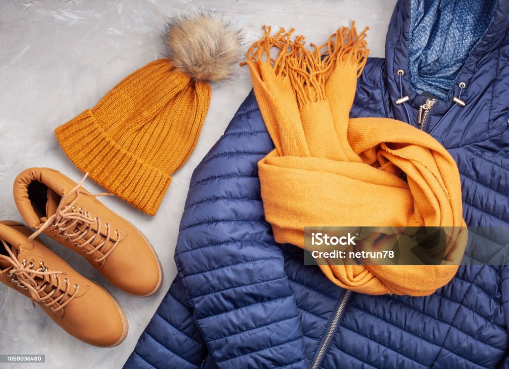 Flat lay with comfort warm outfit for cold weather. Comfortable autumn, winter clothes shopping, sale, style in trendy colors idea Flat lay with comfort warm outfit for cold weather. Comfortable autumn, winter clothes shopping, sale, style in trendy colors concept Warm Clothing Stock Photo