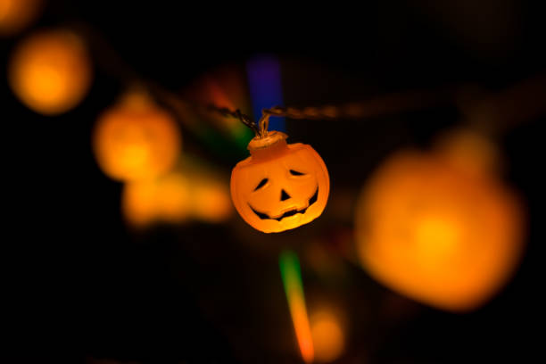istock Halloween pumpkin garland glowing in the dark 1058041286