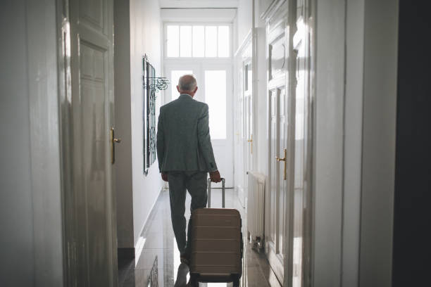 istock Senior businessman leaving his hotel apartment 1058041644