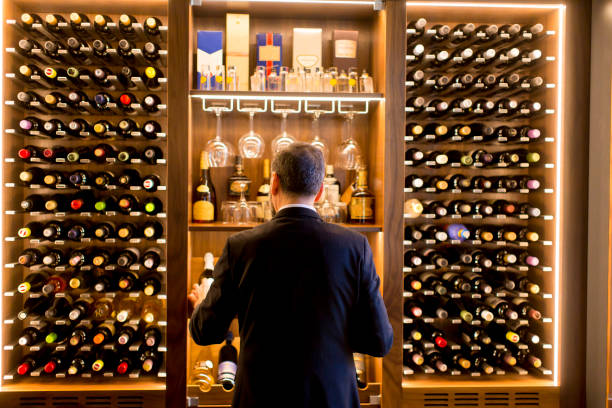 istock Man chooses a bottle of wine 1058042228
