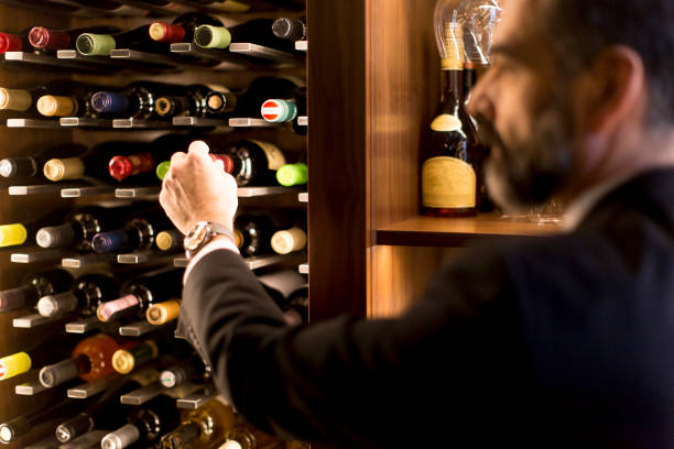 istock Man chooses a bottle of wine 1058042232