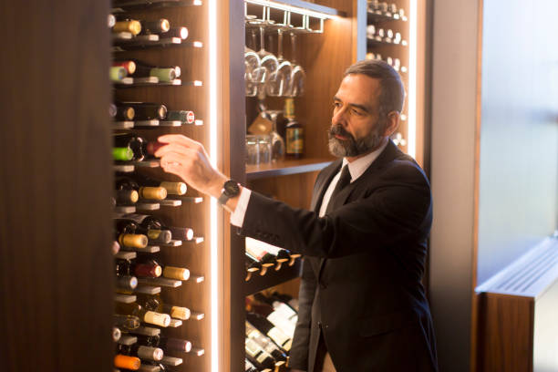 istock Man chooses a bottle of wine 1058042234