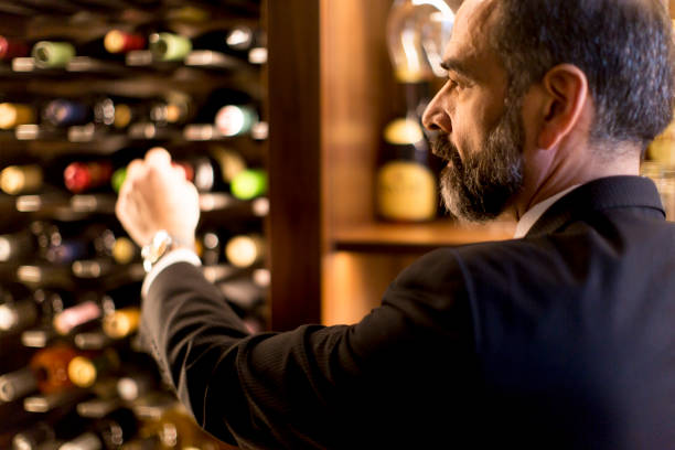 istock Man chooses a bottle of wine 1058042240