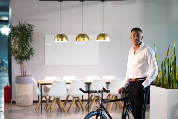 istock Successful millennial entrepreneur stands proudly in his office 1058043686