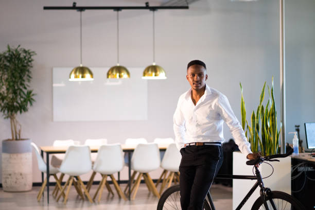 istock Successful millennial entrepreneur stands proudly in his office 1058043742