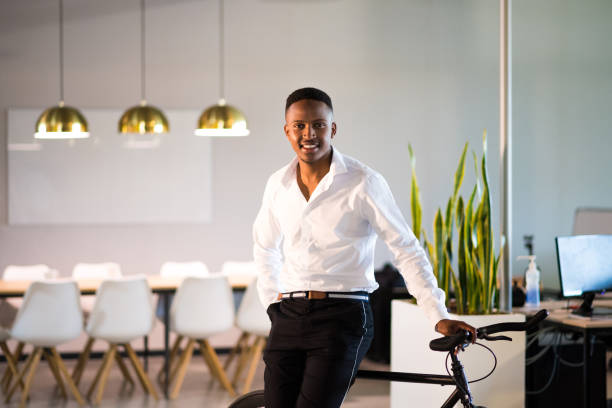 istock Successful millennial entrepreneur stands proudly in his office 1058043778