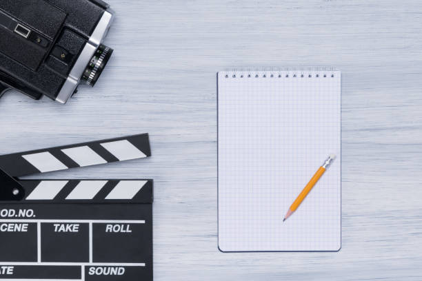 istock on a bright background of the director's desk are a notebook and a camera 1058043786