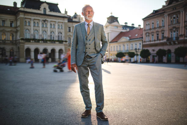 istock Businessman with a cool attitude standing on a town square 1058044254