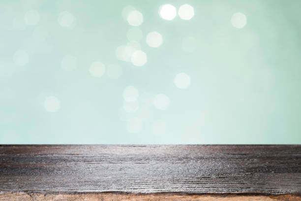 istock Wooden table with mint  bokeh abstract background. 1058044296