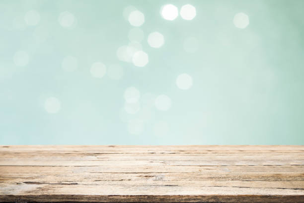 istock Wooden table with mint  bokeh abstract background. 1058044298