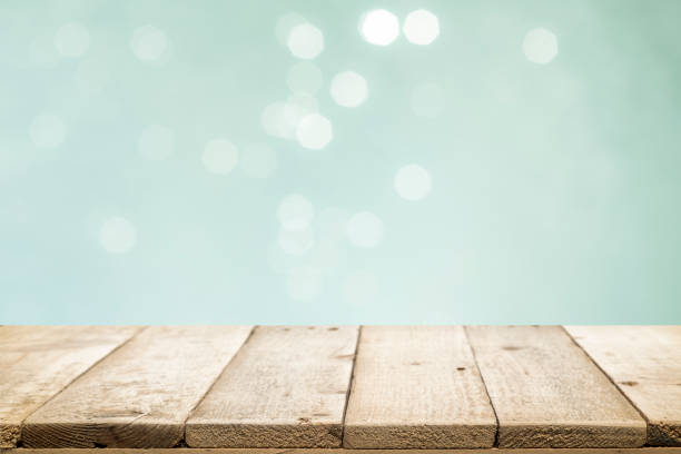 istock Wooden table with mint  bokeh abstract background. 1058044304