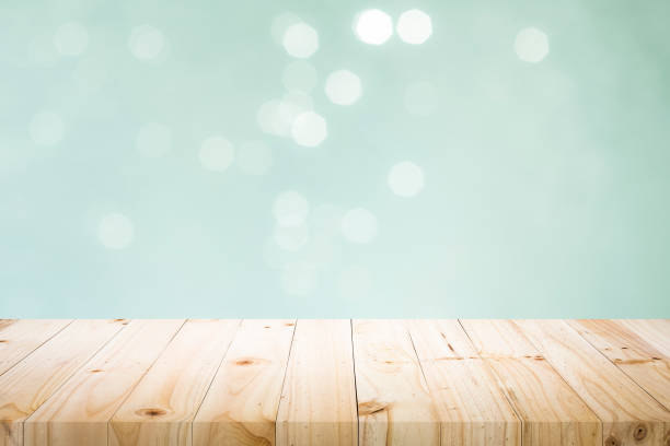 istock Wooden table with mint  bokeh abstract background. 1058044322
