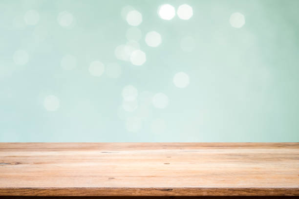 Wooden table with mint  bokeh abstract background.