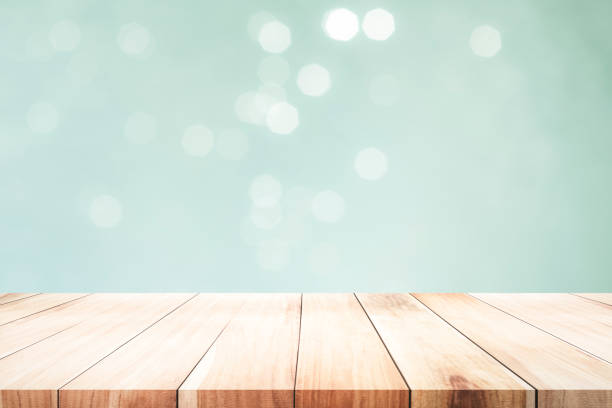 istock Wooden table with mint  bokeh abstract background. 1058044326
