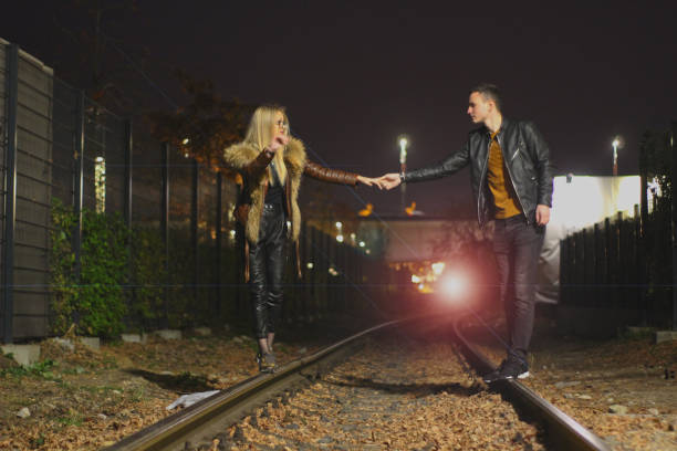 istock Two young people in love on the rails 1058045548