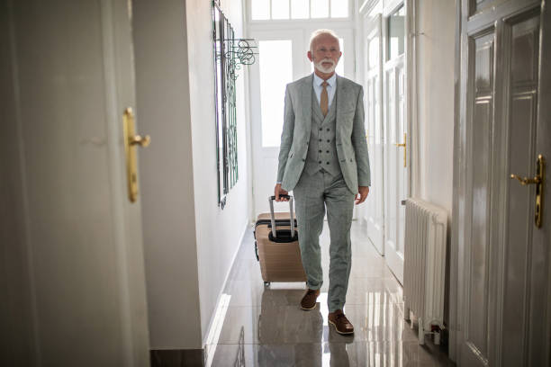 Senior businessman entering his hotel apartment