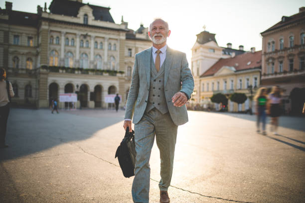 Modern senior businessman going to his office