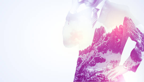istock Businessman standing with mountain graphic 1058047524