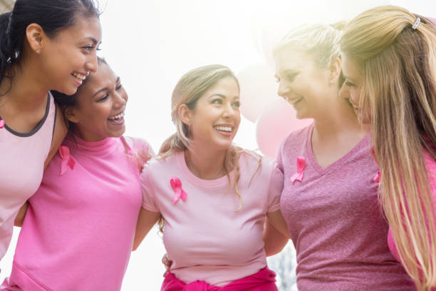 istock Group of women huddle before race for cure 1058047664