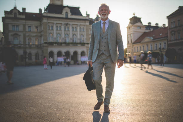 istock Lovely senior businessman going to the office 1058048196