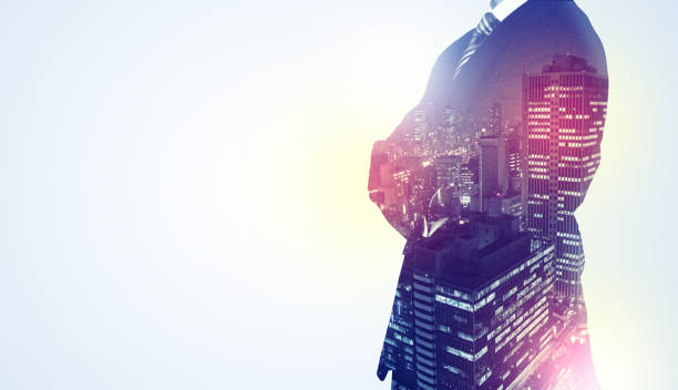 istock Businessman standing with night city graphic 1058049250