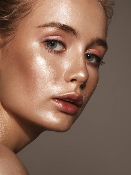 istock Beautiful woman with shiny make-up 1058049694