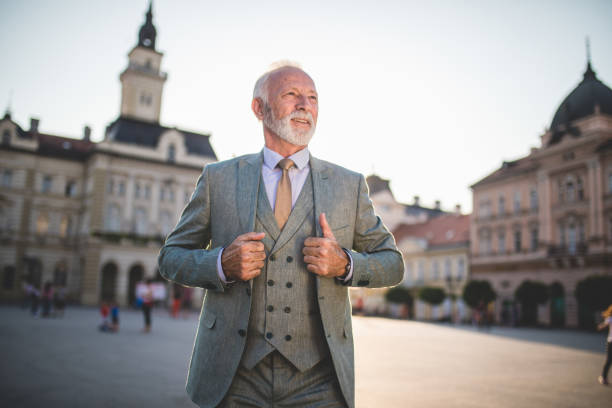 istock Cheerful senior businessman on a town square 1058050350