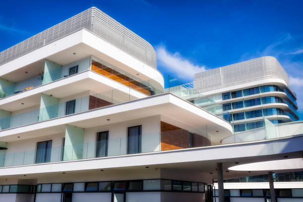 istock Modern architecture with large white balconies in modern white apartment building 1058051110