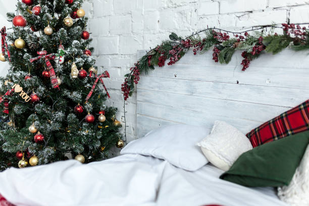 istock New year bedroom interior. Bed with cozy cushions 1058056994