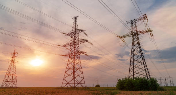 istock high-voltage lines against the background of electrical distribution stations at sunrise. 1058060508