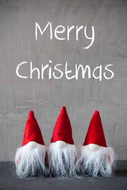 istock Three Red Gnomes, Cement, Text Merry Christmas 1058060560