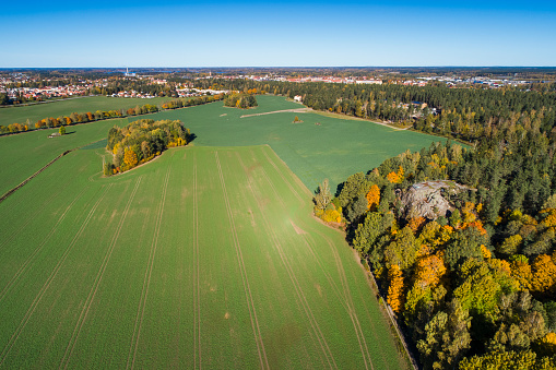 Katrineholm Sweden. Beautiful nature and landscape photo of colorful autumn day in Scandinavia. Nice outdoors image. Calm, peaceful, joyful and happy picture. Shot with drone from above.