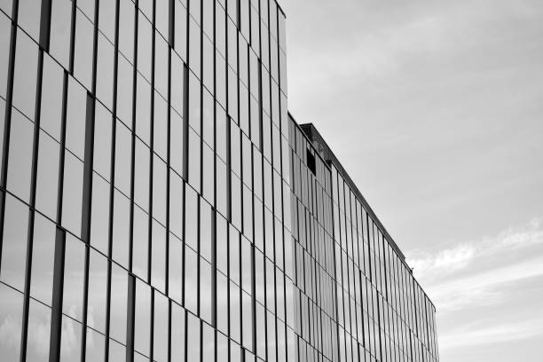 istock Modern building. Modern office building with facade of glass. Black and white. 1058064208