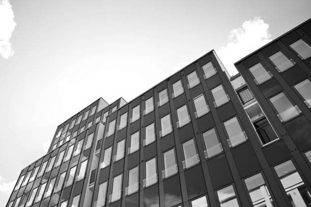 istock Modern building. Modern office building with facade of glass. Black and white. 1058064228