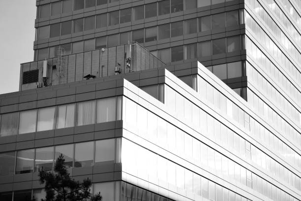 istock Modern building. Modern office building with facade of glass. Black and white. 1058064332