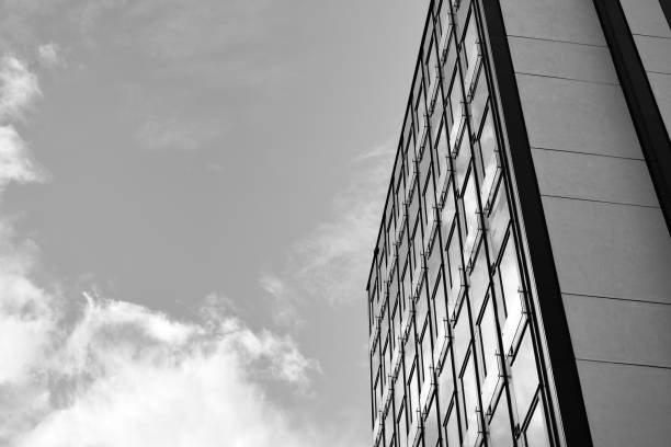 istock Modern building. Modern office building with facade of glass. Black and white. 1058068718